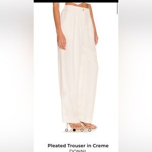 NWT DONNI. Pleated Trousers in soft butter color, size small